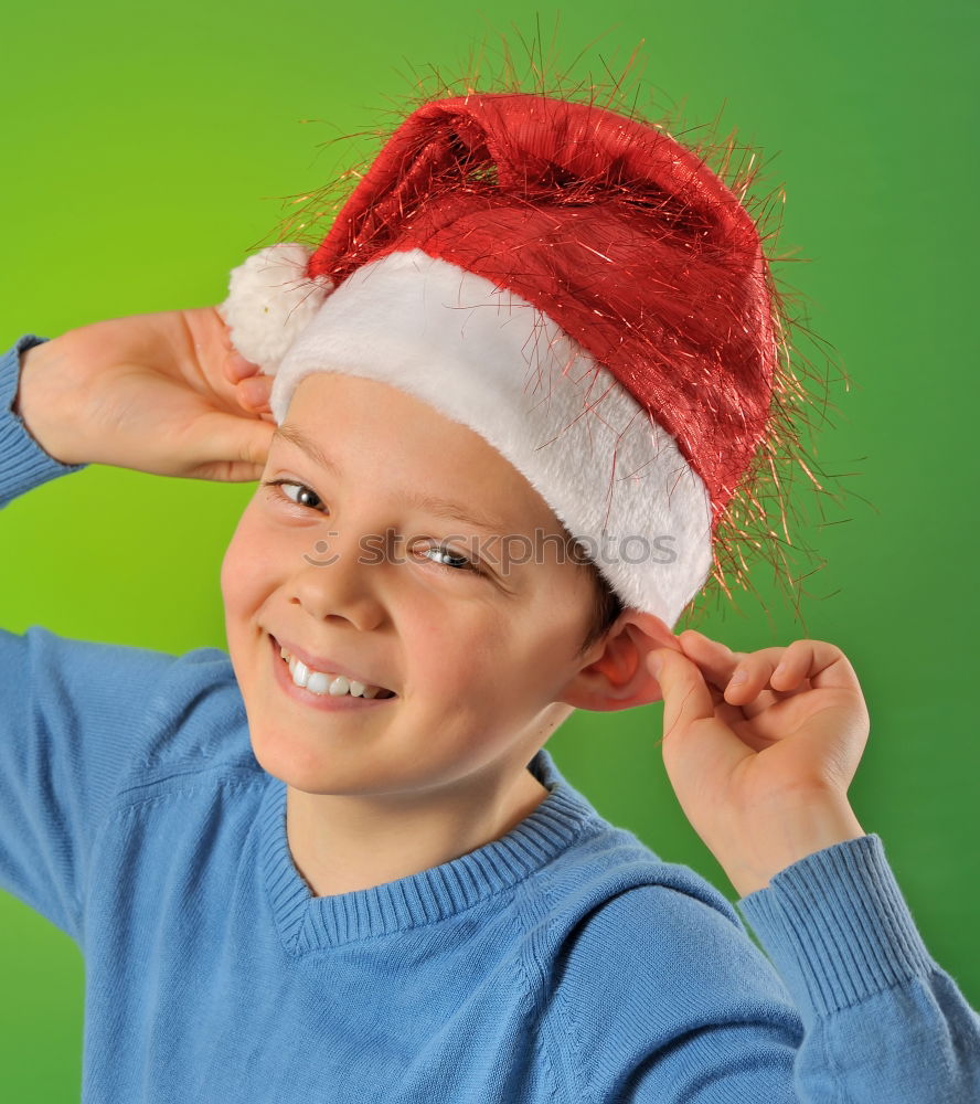 Similar – Image, Stock Photo Adorable kid with Santa´s hat on Christmas day.