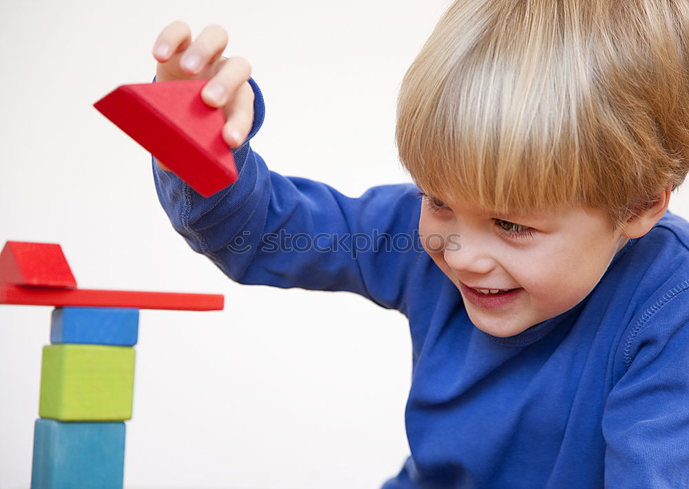 Similar – Image, Stock Photo Happy baby playing with toy blocks.