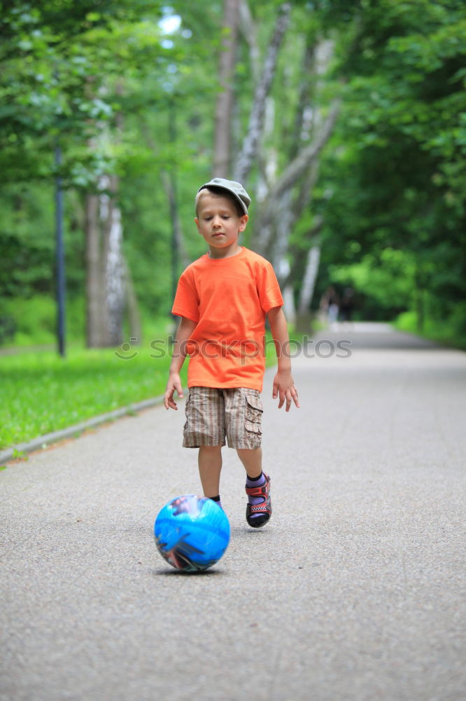 Similar – Image, Stock Photo child plays soccer with a ball