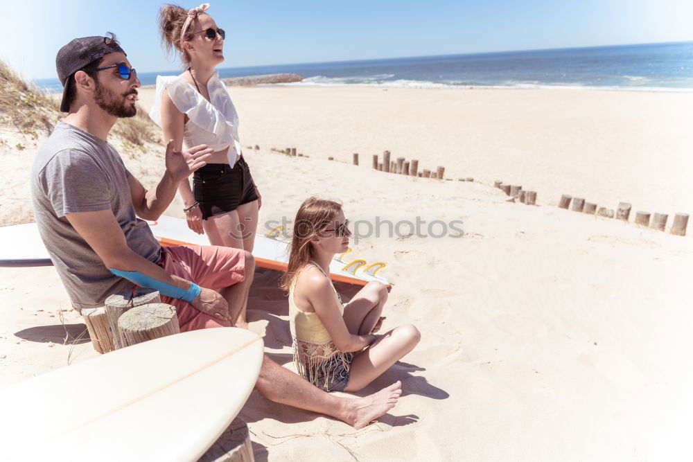 Image, Stock Photo Group of friends hanging out at beach in summer