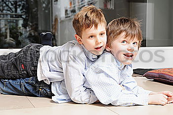 Similar – Image, Stock Photo Smiling twins brothers playing