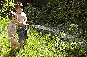 Similar – Sprinkler Fun Summer Water