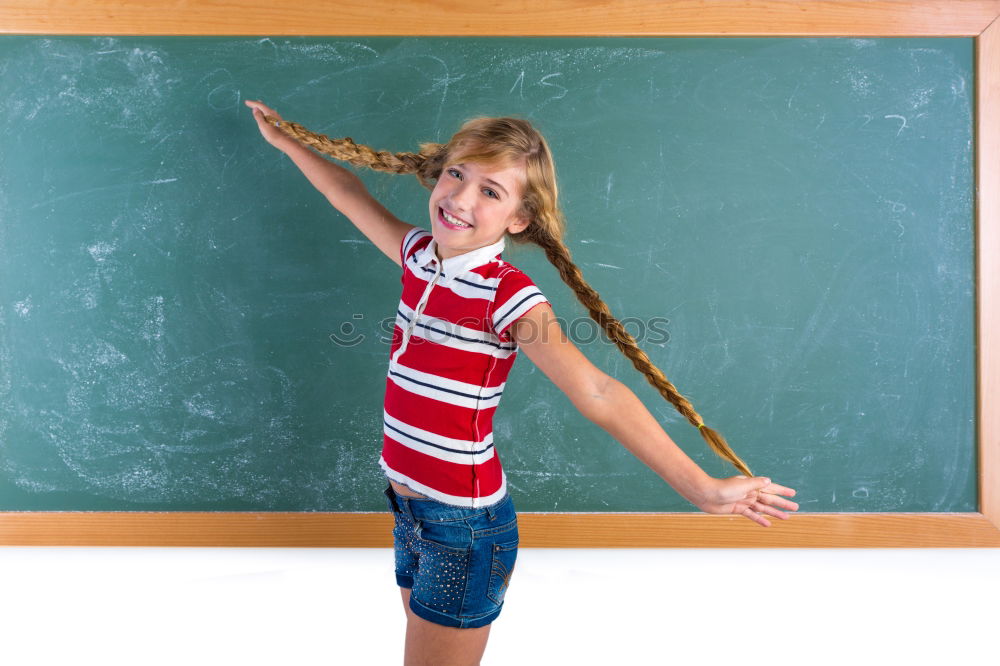 Similar – Pupil writing on the blackboard