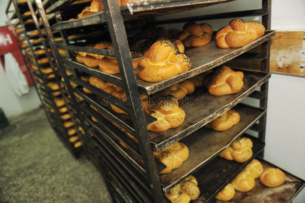 Similar – Baker carrying rack with fresh pastry