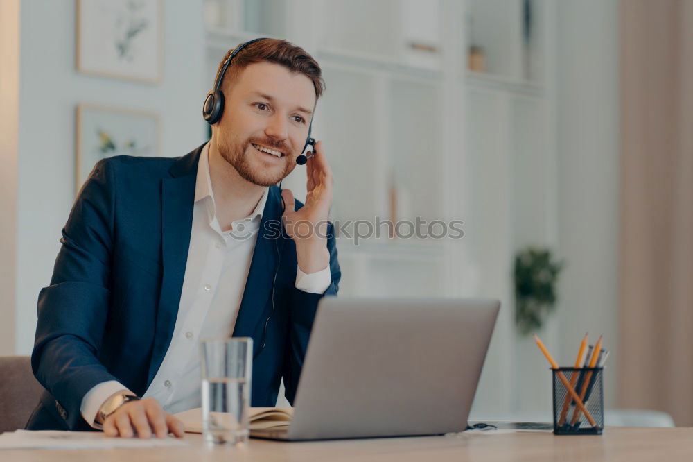 Similar – Image, Stock Photo Handsome businessman with striped tie sits at table with coffee making phone call and using his tablet