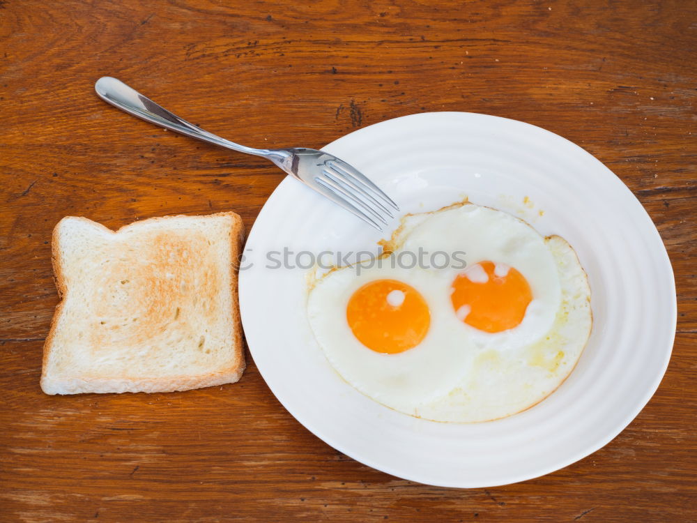 Similar – Fried egg face on wood