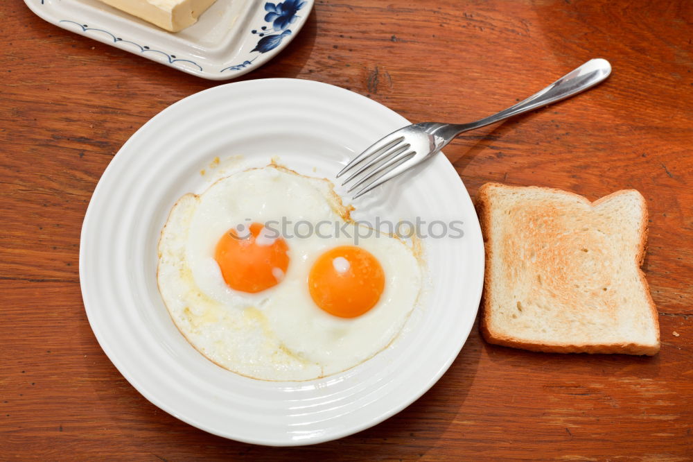 Similar – Fried egg face on wood