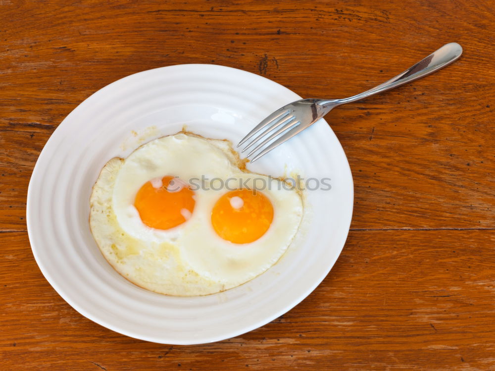 Similar – Fried egg face on wood