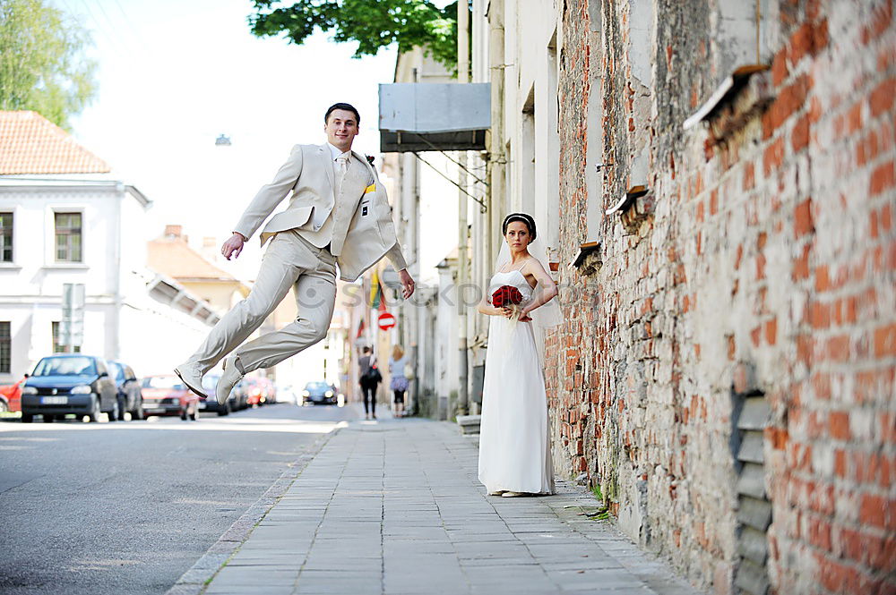 Similar – Happy man jumping wearing winter clothes in the street