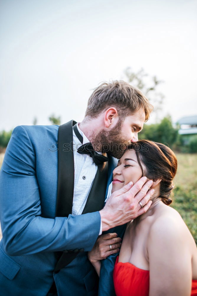 Similar – Image, Stock Photo Couple embracing on evening street