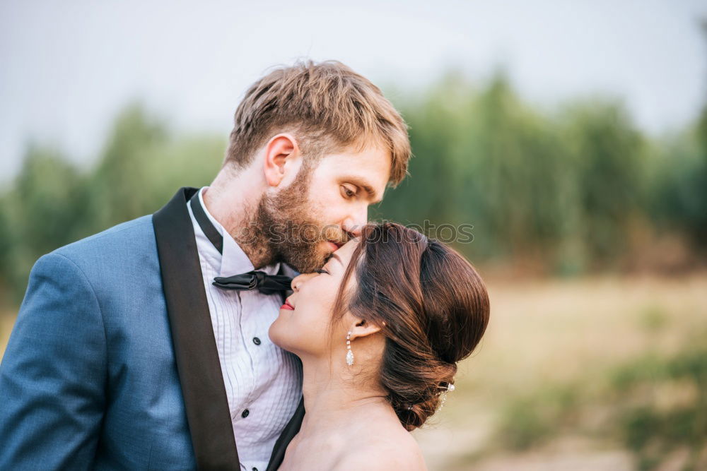 Similar – Image, Stock Photo Young loving couple hugging in the street.