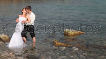 Similar – Mixed race couple on the beach, honeymoon