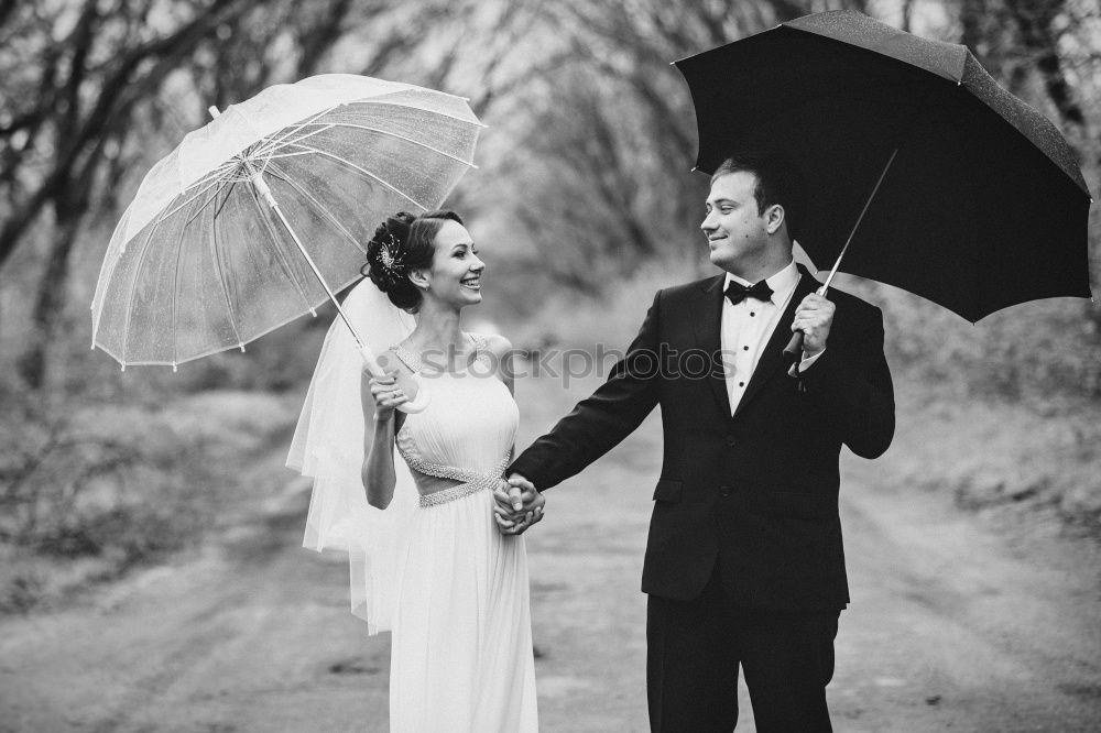 Similar – couple in the rain Elegant