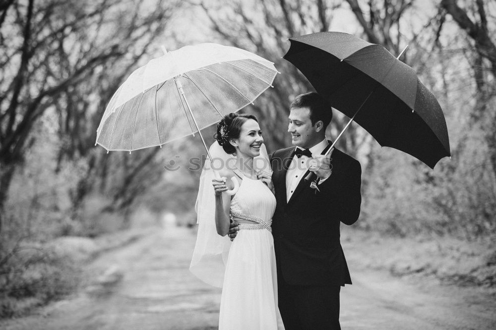 Similar – couple in the rain Elegant