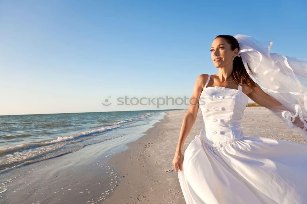 Similar – Image, Stock Photo Bride on the beach Wedding