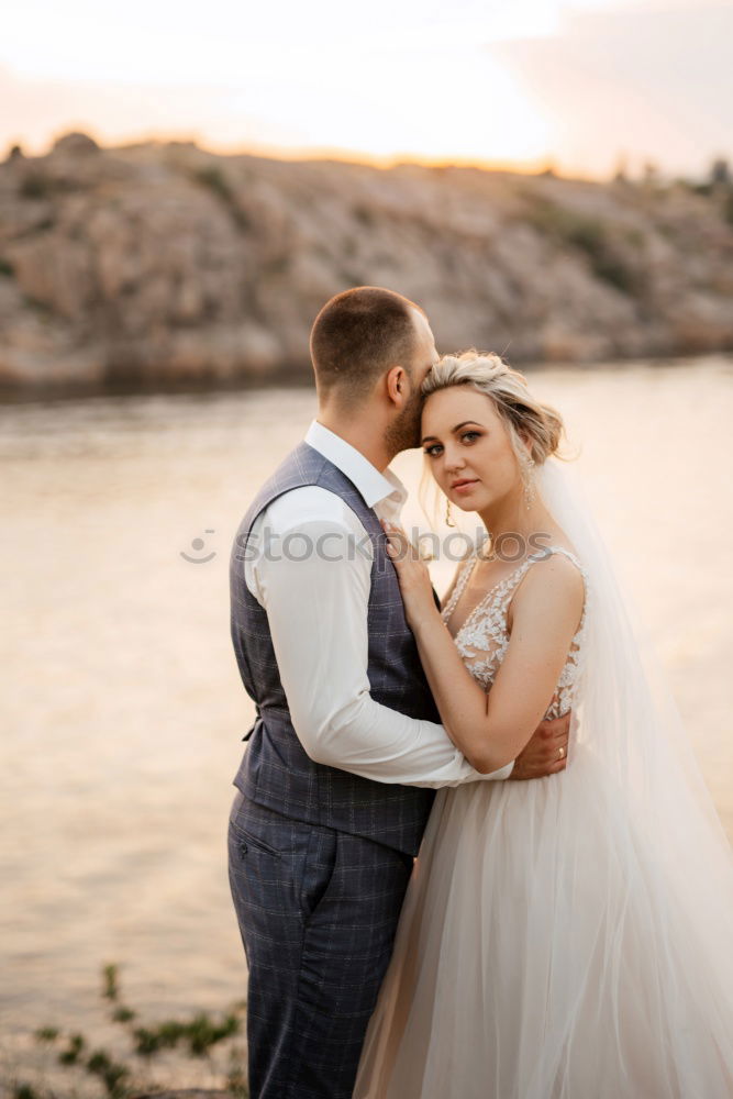 Similar – Image, Stock Photo Sensual wedding couple kissing on shoreline