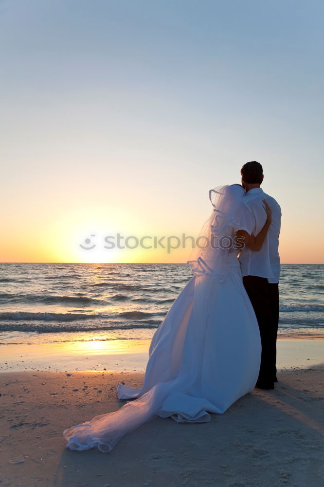 Image, Stock Photo Tender kissing bridal couple in sunlight