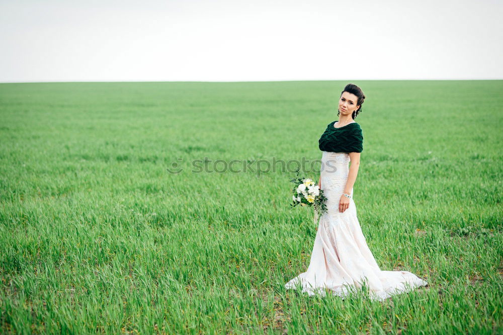 Similar – beautiful girl with short haircut and wearing black clothes in countryside enjoying the sunset