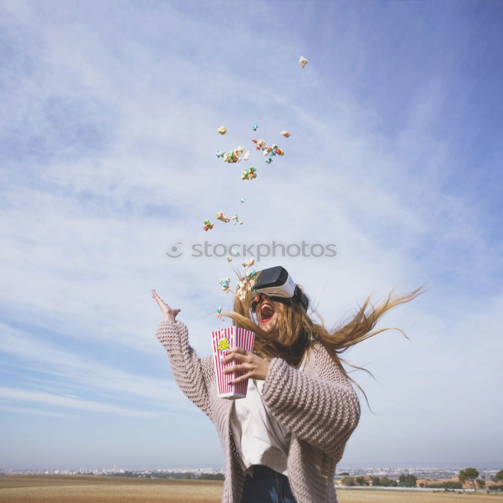 Similar – Woman throwing up hat in nature