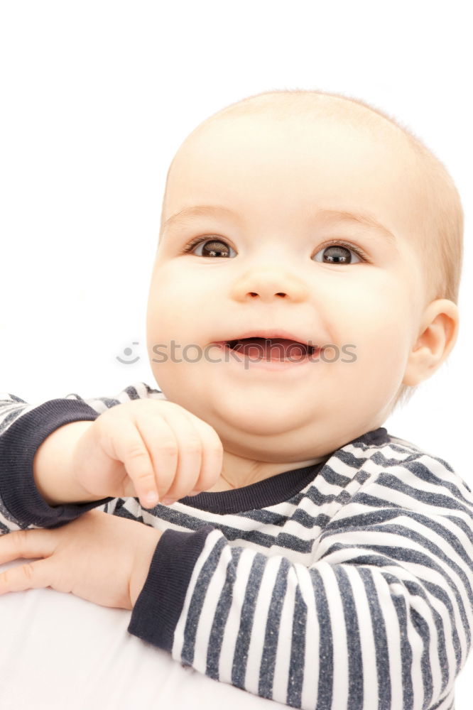 Similar – a happy baby boy sitting on a sofa and smilling