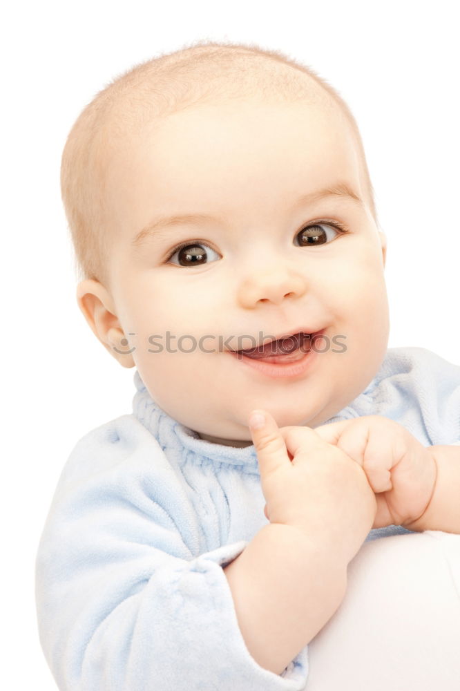 Similar – a happy baby boy sitting on a sofa and smilling