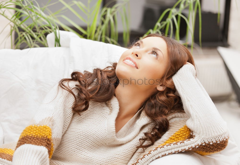 Similar – Cheerful woman lying with book