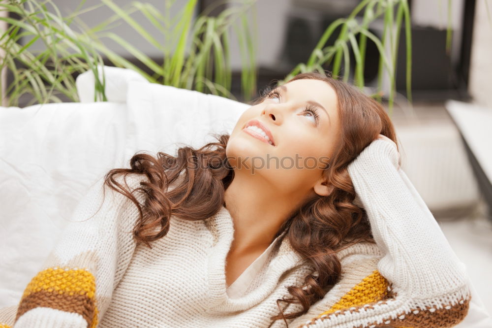 Image, Stock Photo AST 9 | Flower of the Orient: An unknown beautiful woman with blue eyes lies on a sofa