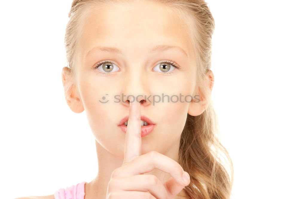 Similar – Young Girl Gesturing Silence.