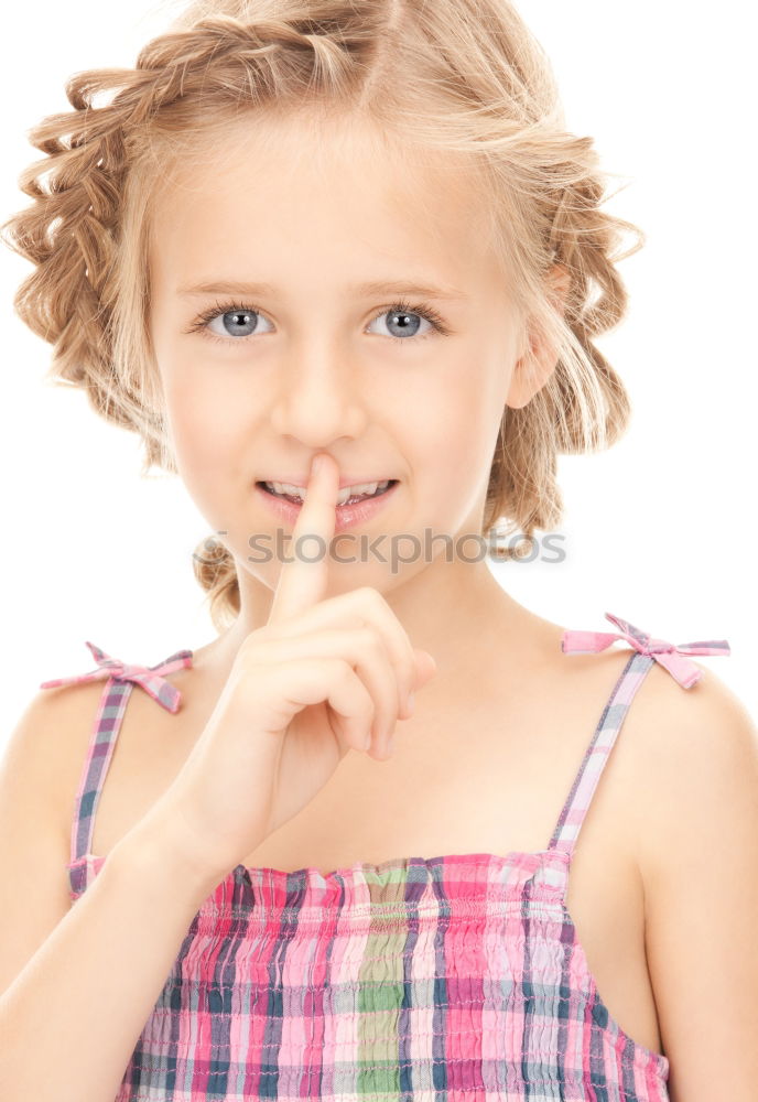 Similar – Young Girl Gesturing Silence.