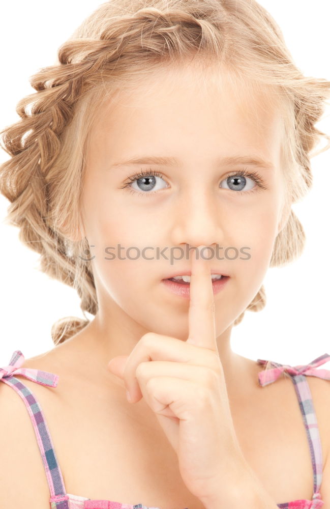 Young Girl Gesturing Silence.