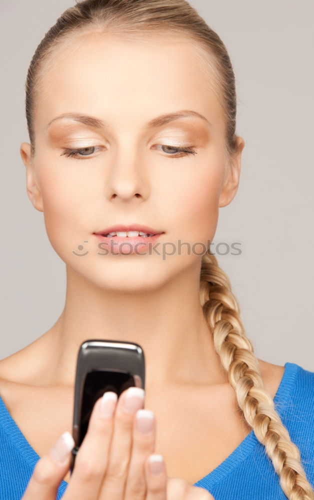 Similar – Image, Stock Photo Young woman looking at her smartphone