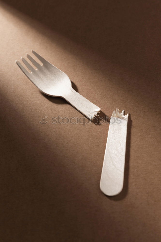 Similar – old metal fork and spoon tied with a brown rope