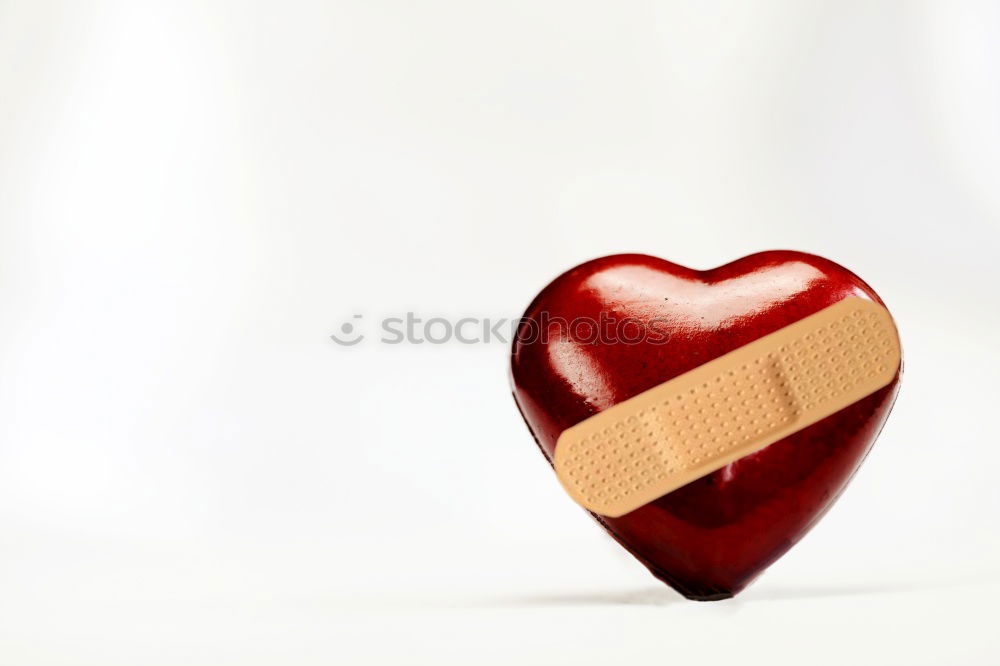 Similar – A plaster with a little red heart on it on skin. Concept lovesickness, injury and care.