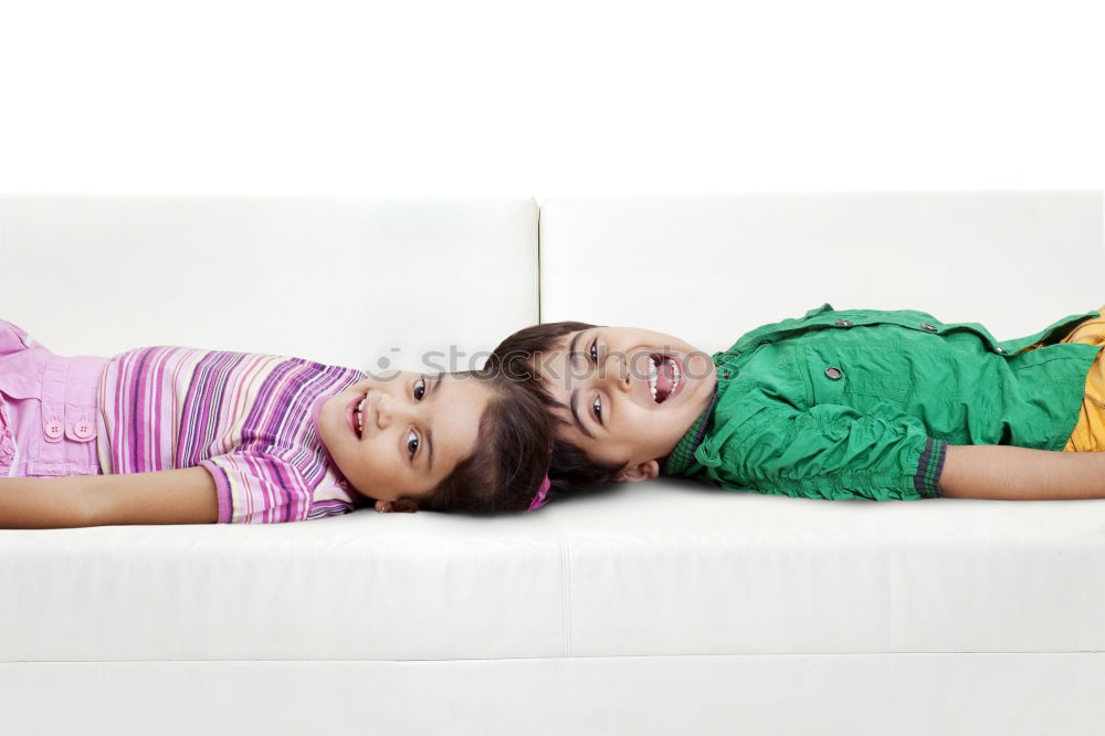 Similar – Two beautiful sisters playing on bed