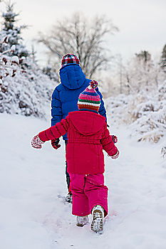 Similar – Mother is playing with her little daughter outdoors in winter