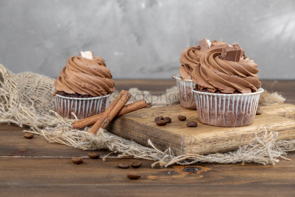 Similar – Image, Stock Photo white etagere with chocolate cake muffin and its preparation