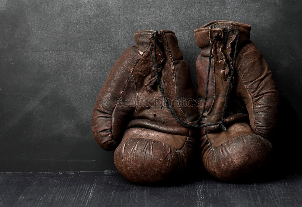 pair of old leather boxing gloves