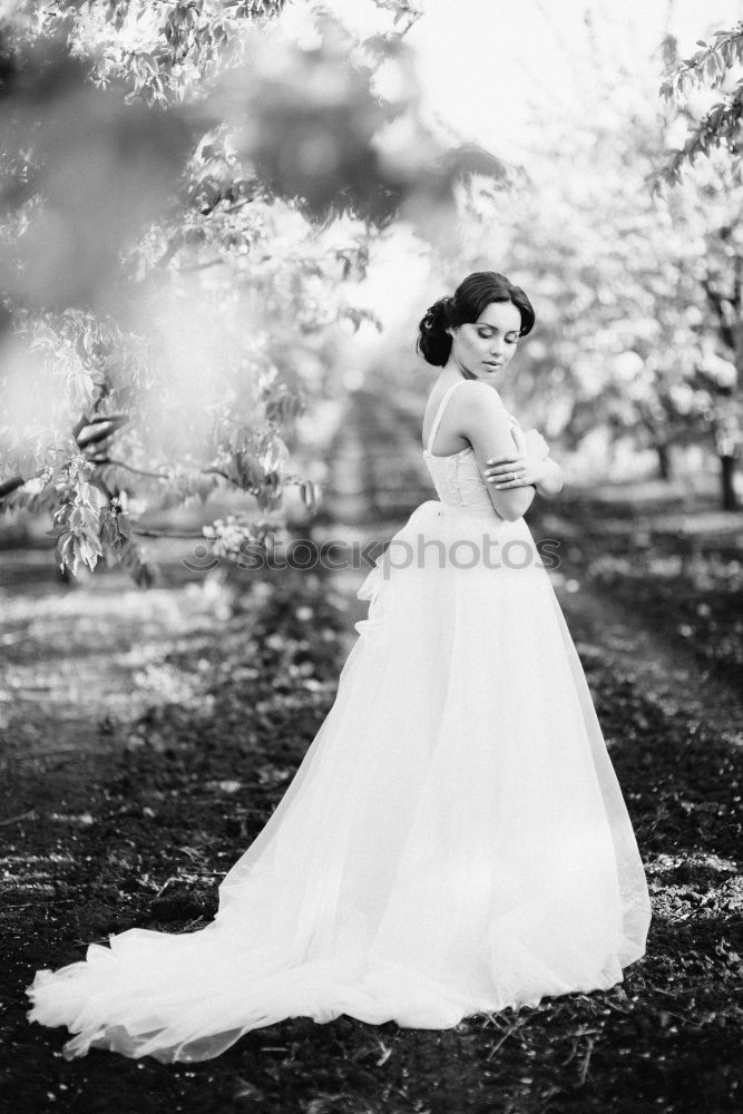 Similar – Young woman smelling almond flowers in springtime