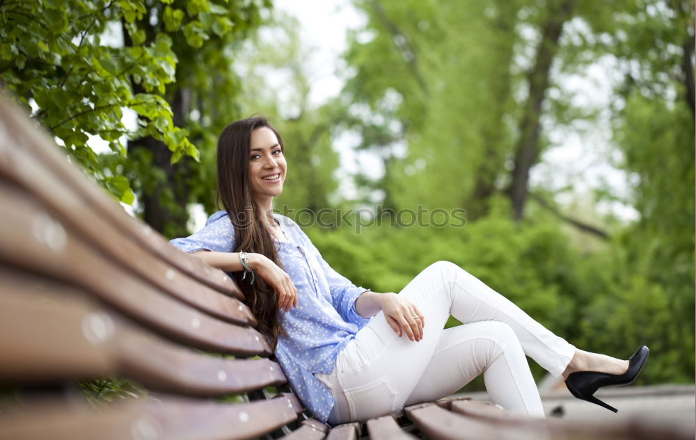 Similar – A young woman listening music on digital tablet sitting