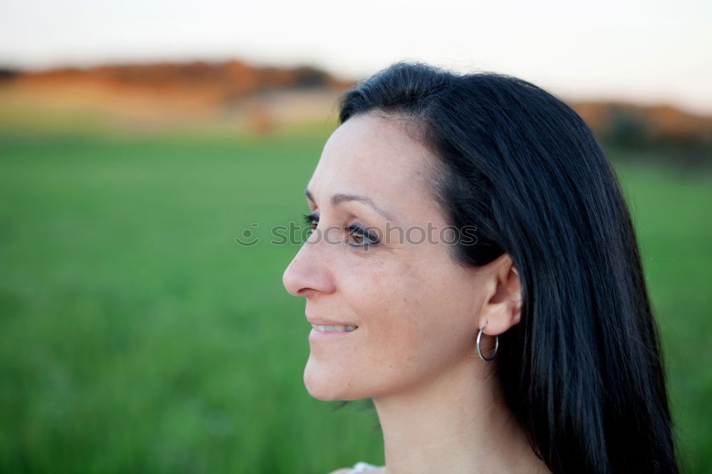 Similar – Young woman wearing casual clothes smiling in urban background