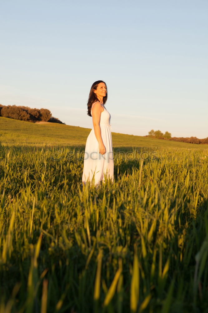 Similar – Image, Stock Photo Woman looking at side relaxing on a meadow