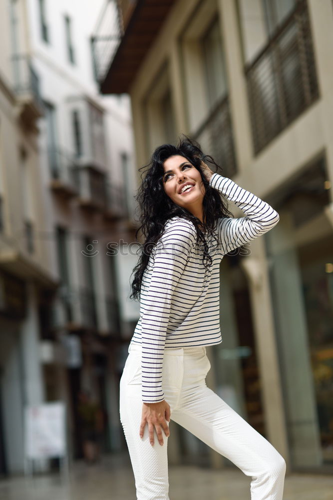 Similar – Smiling young arabic woman with black curly hairstyle