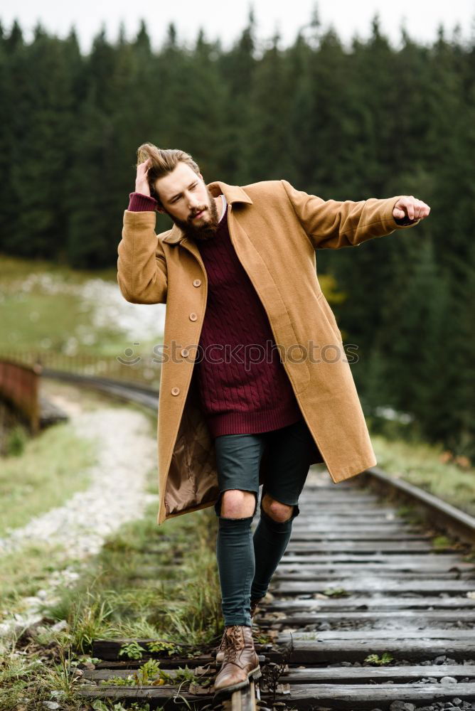 Similar – Man running on railroad