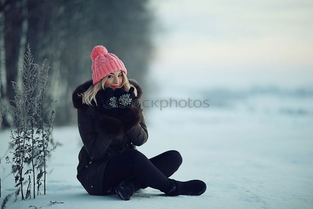 Similar – Young blonde woman lost in a snowy forest