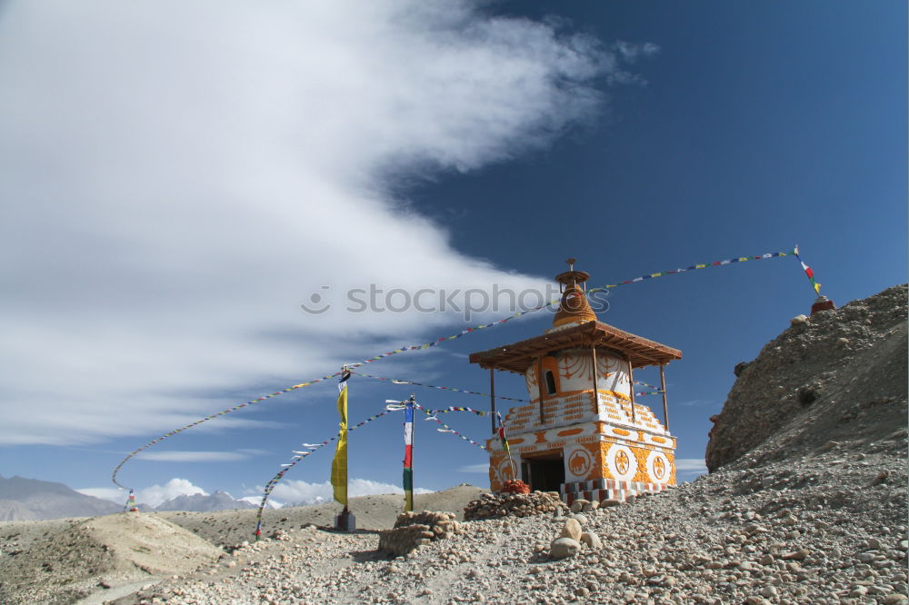 Buddhist prayer flags flowing in the wind in Himalayas