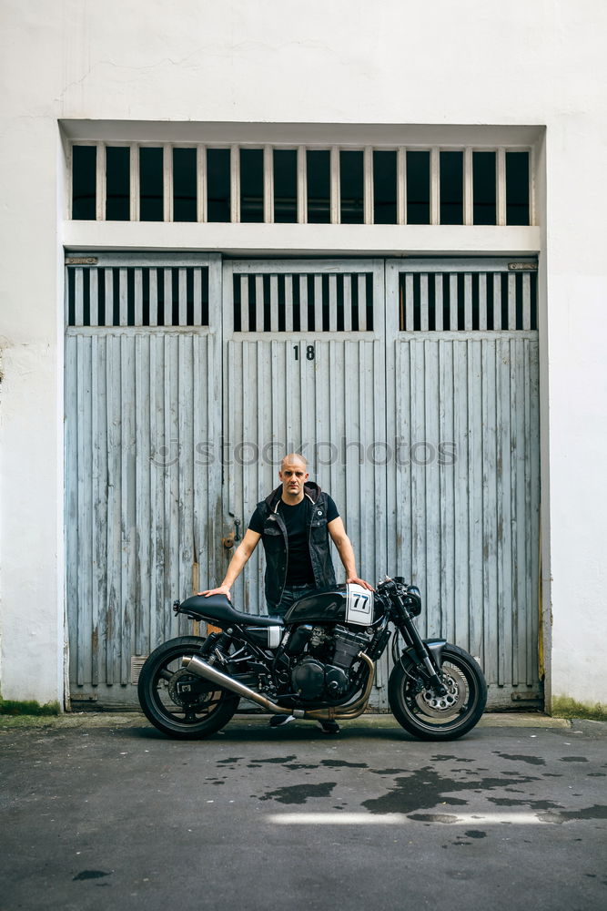 Similar – Image, Stock Photo Biker checking with a motorcycle