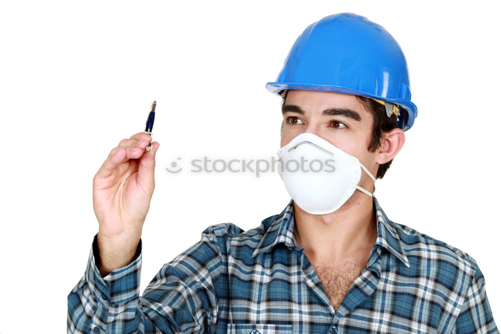 Similar – Workman in protective mask and glasses standing on street