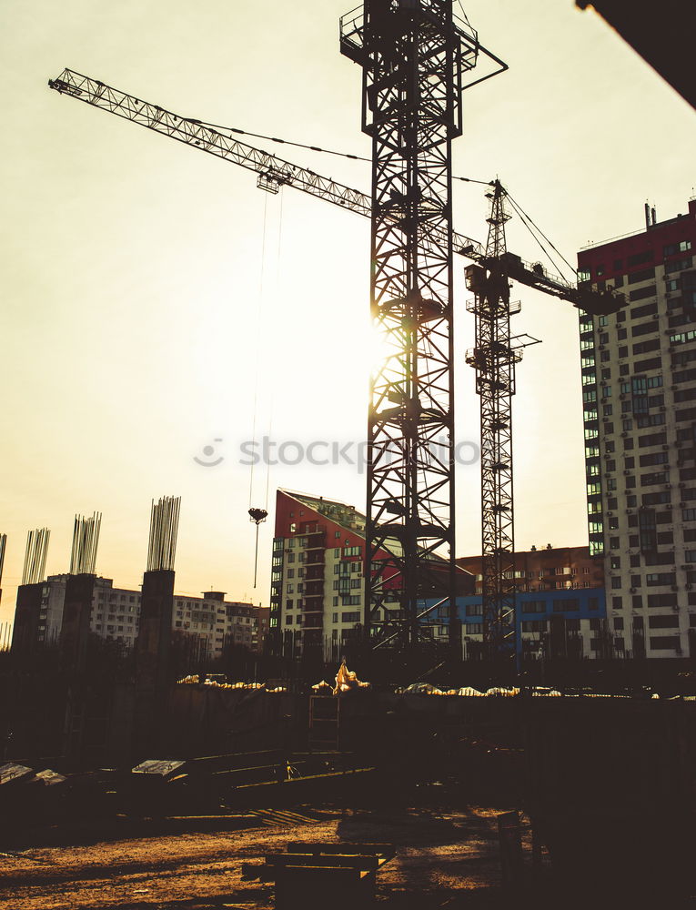 Similar – Construction site with building cranes