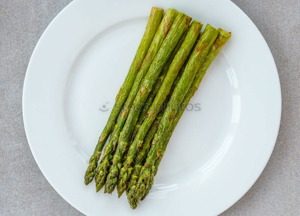 Similar – Image, Stock Photo Portion of asparagus bunch with green, fresh, juicy asparagus, from fresh, local harvest, lies in heaps, bundles on a white cloth made of linen.