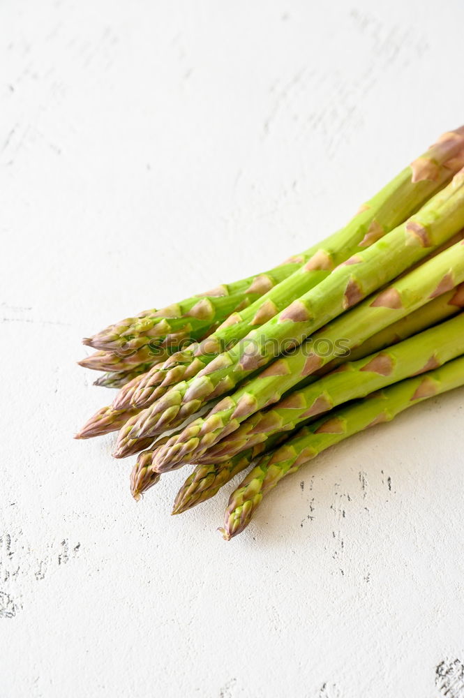 Similar – Image, Stock Photo Fresh raw asparagus spears on a white table